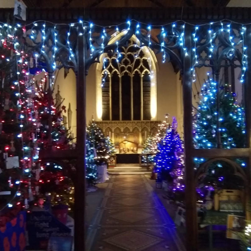 Fakenham Christmas Tree Festival, Fakenham Parish Church, Market Place, Norfolk, Fakenham NR21 9BX | 40+ lit and decorated Christmas trees in a beautiful church | Lights, Trees, Gifts, Cake